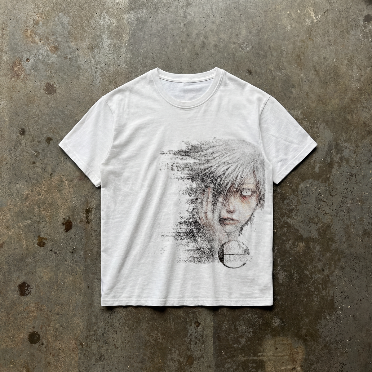 White t-shirt with graphic design on a textured gray background